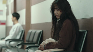 The Woman in the White Car - Film Screenshot 1